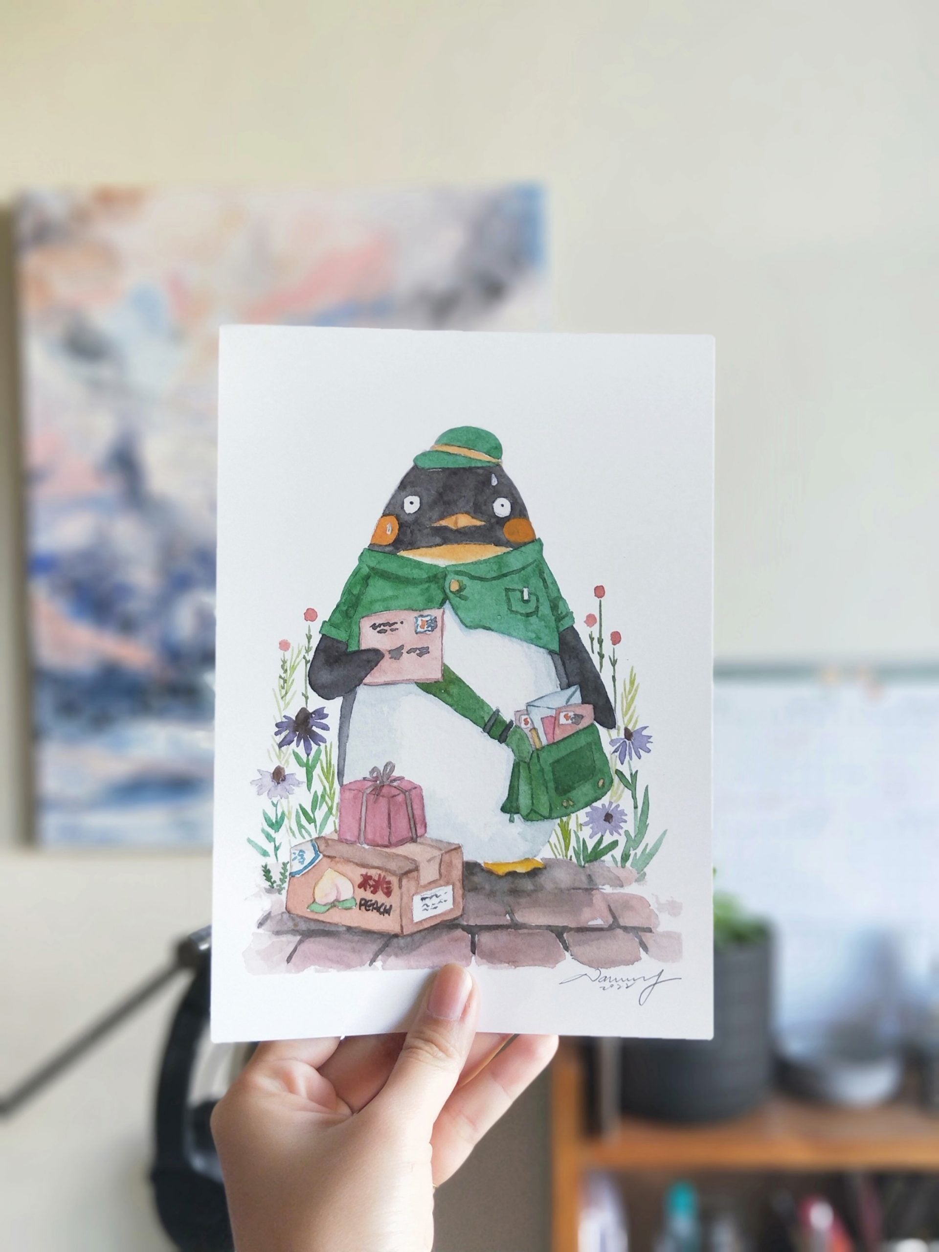 Postman penguin watercolour print in a frame