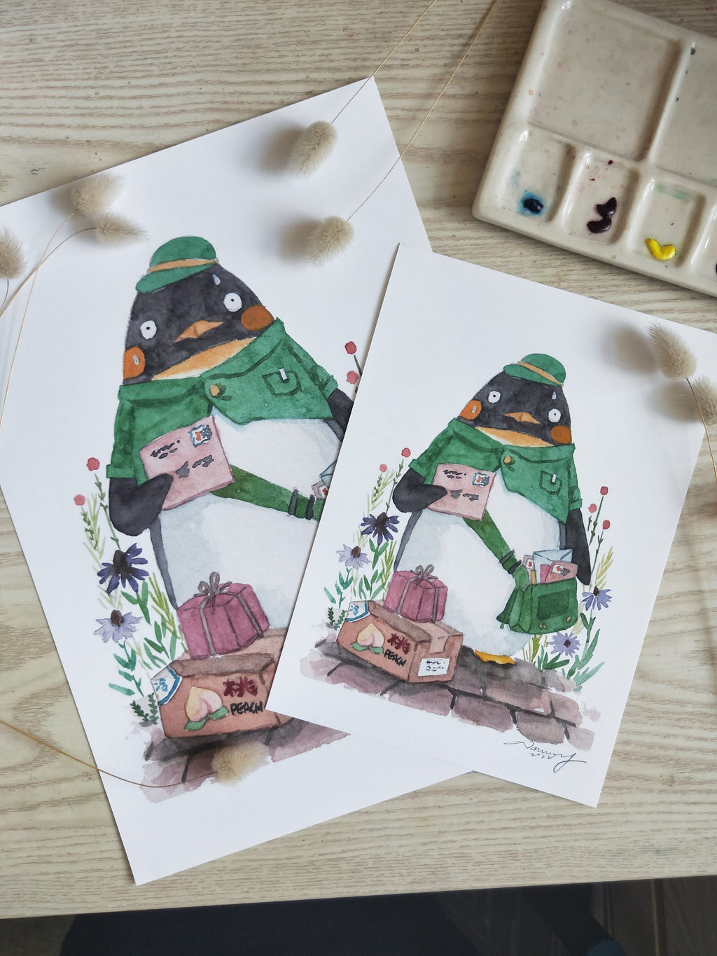 Watercolour illustration of a penguin postman carrying letters