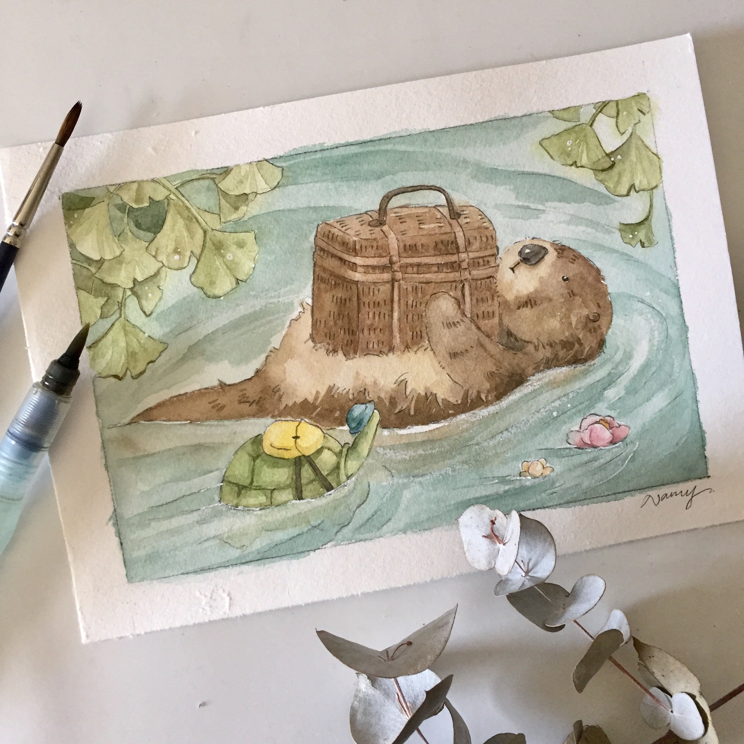 Mr. Otter and turtle print framed on a wall