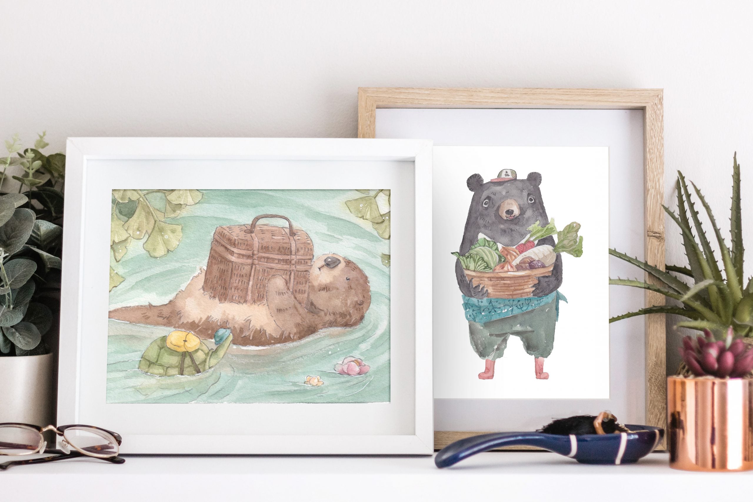 Mr. Otter and turtle print in a frame on a shelf