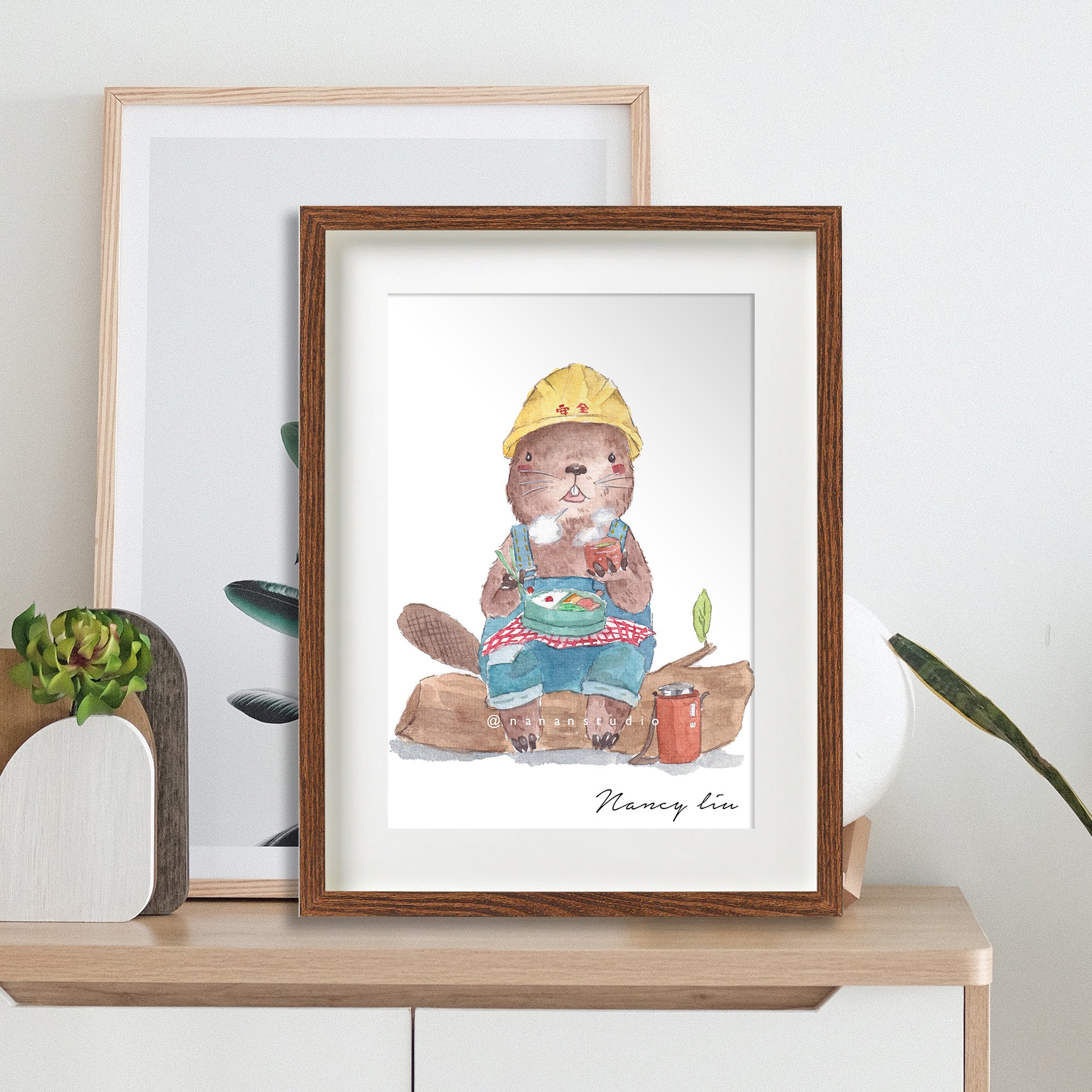 Mr. Beaver's lunch time print framed and styled on a shelf