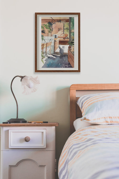 Blue Cat in Cosy Kitchen watercolour art print shown framed on a wall
