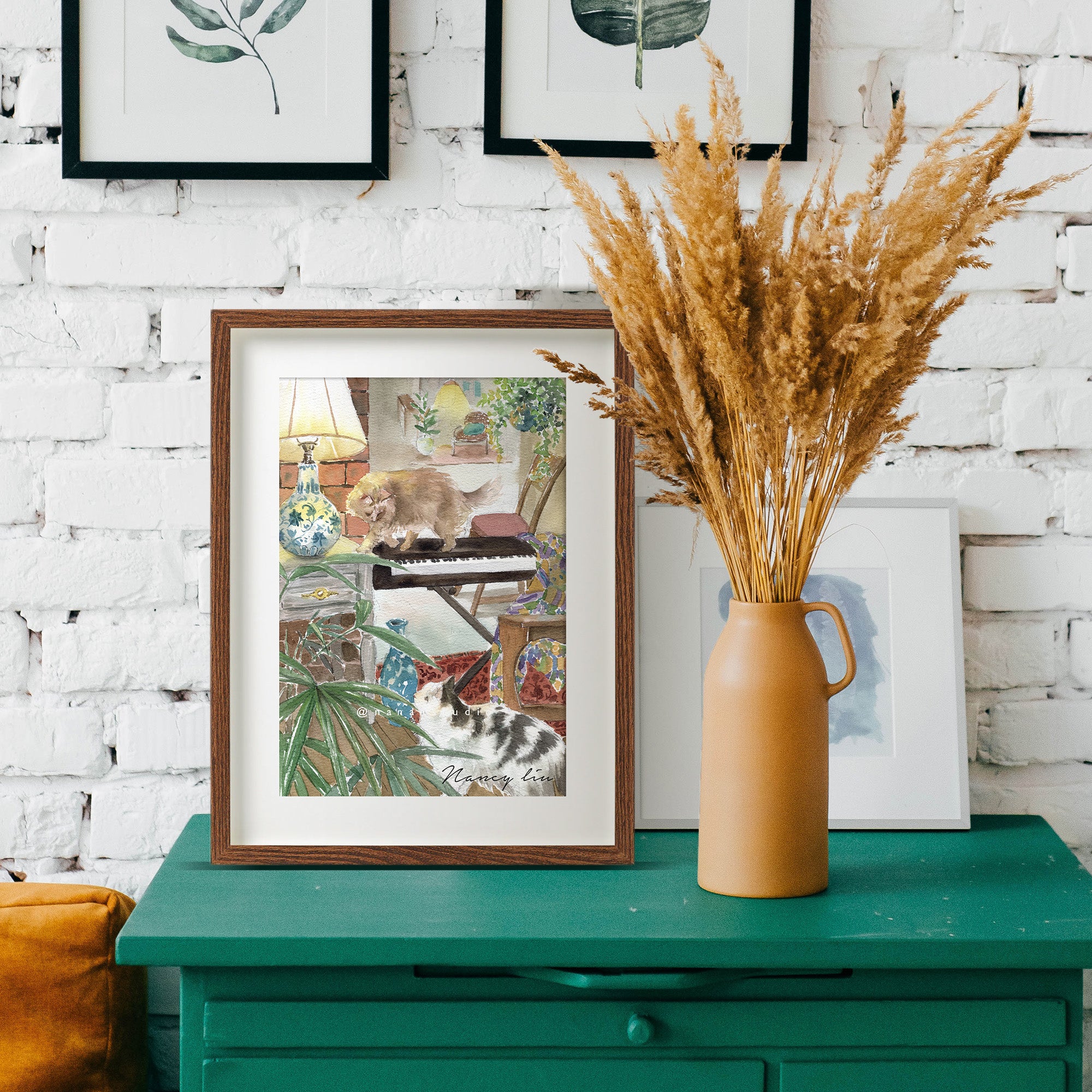Piano and Cats watercolour print displayed in a living room