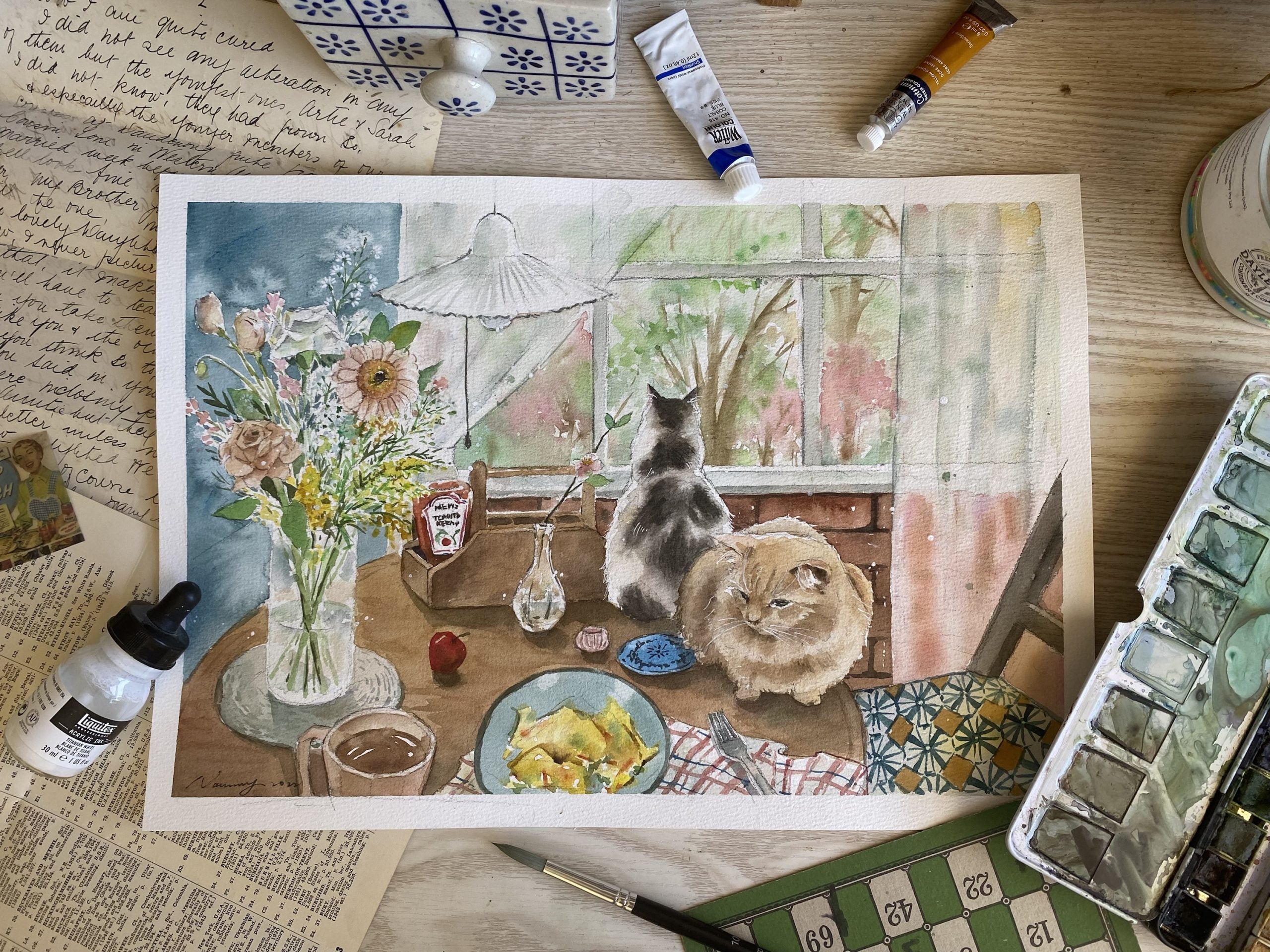 Breakfast with Cats watercolour art print displayed on a dining room wall