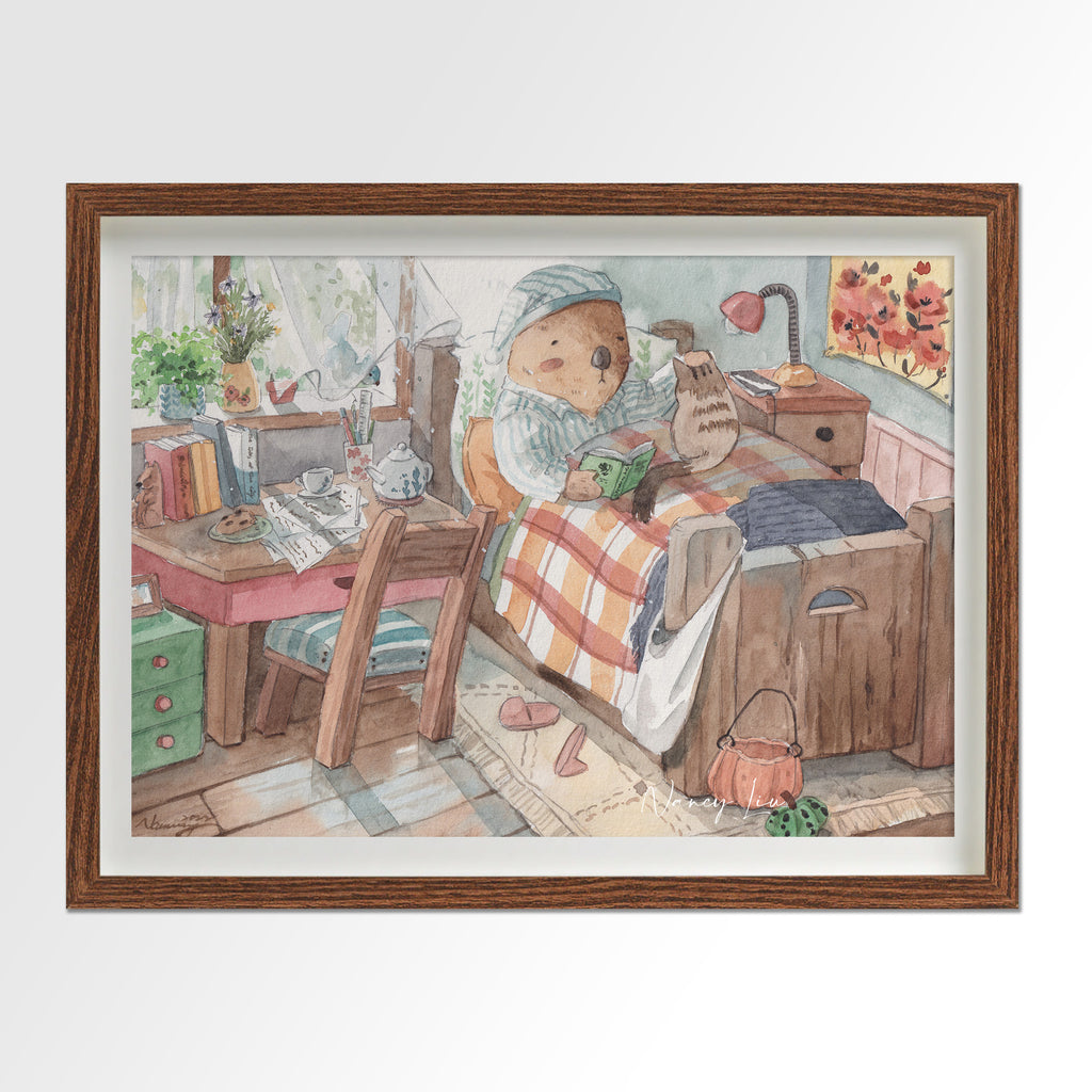 Mr. Otter in bed with kitty print framed beside a bed