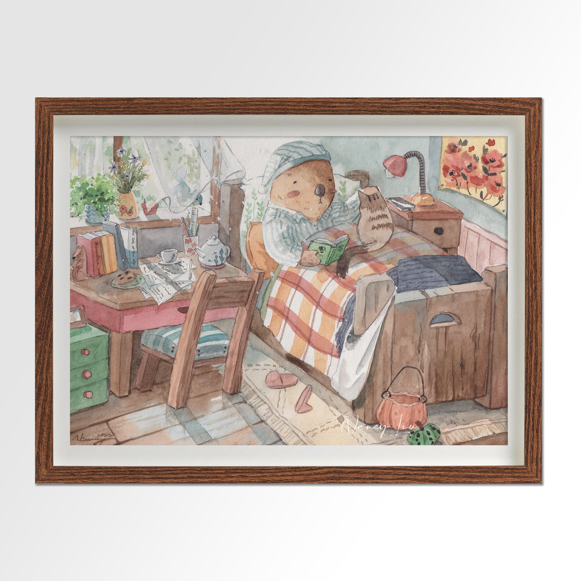 Mr. Otter in bed with kitty print framed beside a bed