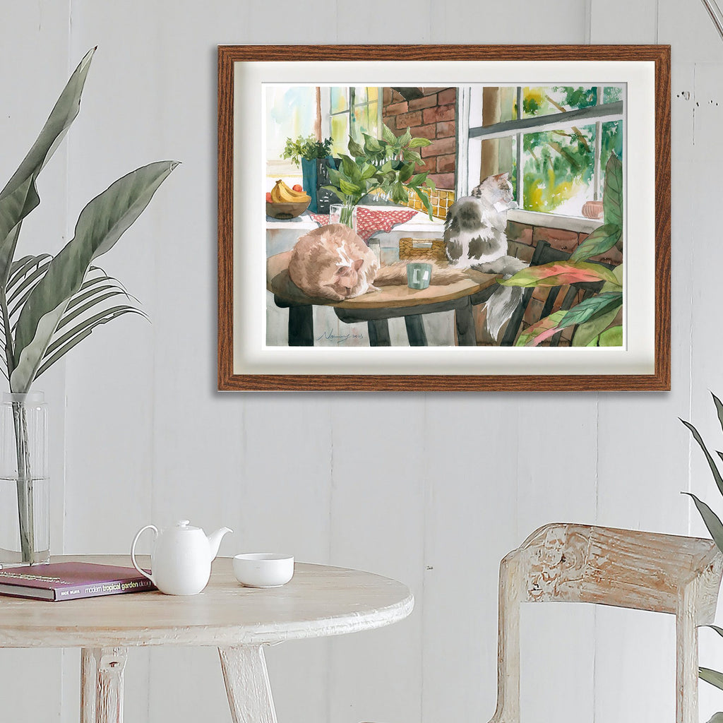 Looking Out the Window cat art print shown framed in a room setting
