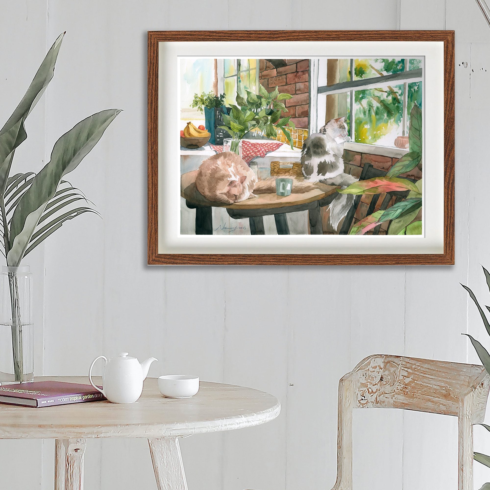Looking Out the Window cat art print shown framed in a room setting