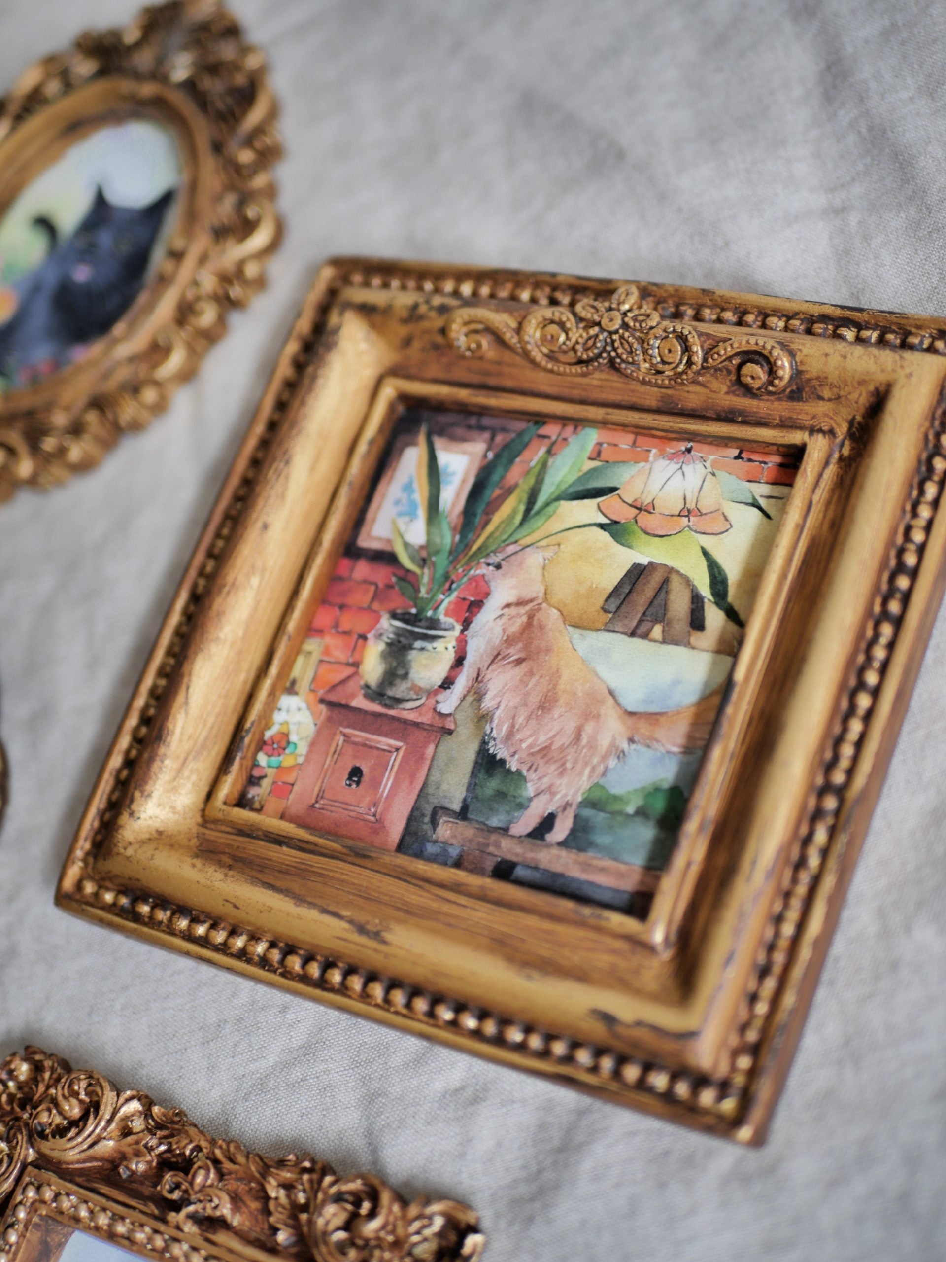 Naughty cat biting plant | vintage mini framed art print