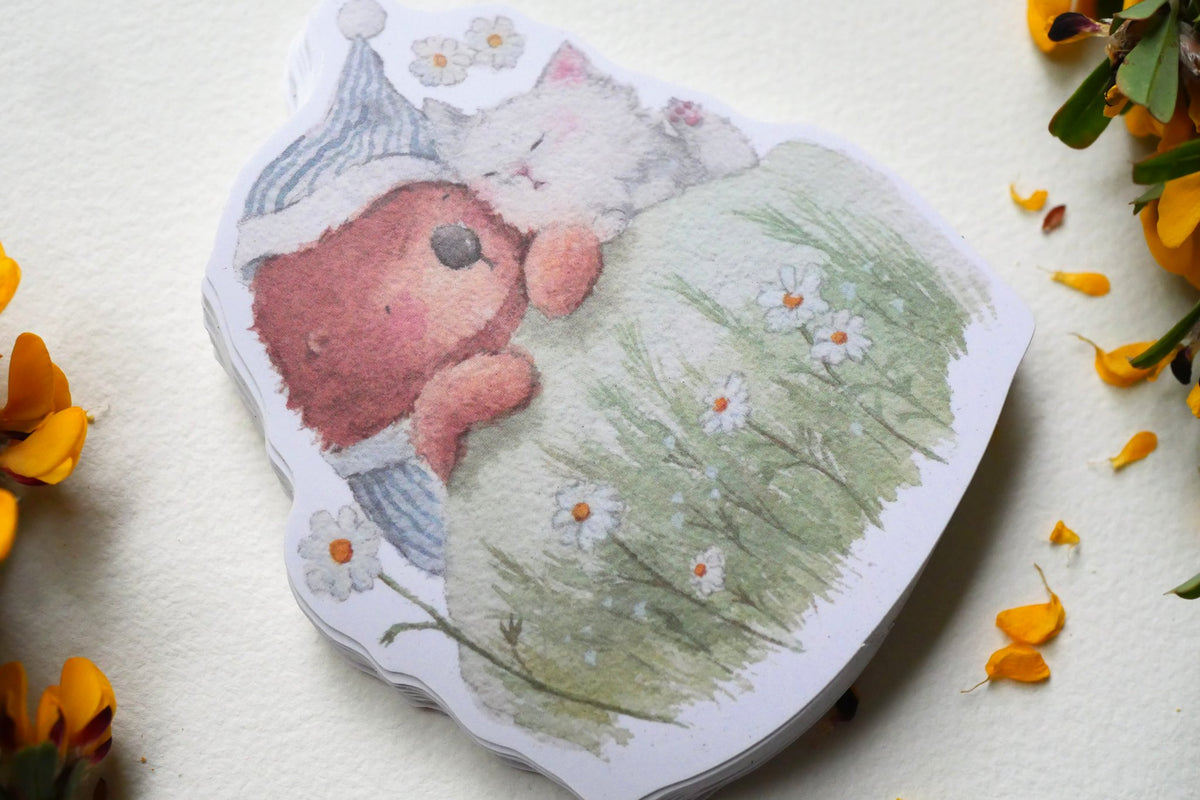 Sleeping otter and kitten vinyl sticker