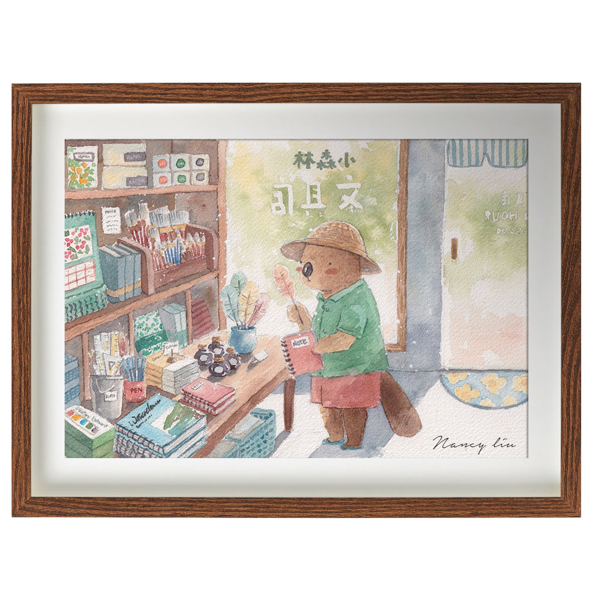 Stationery shop print framed and styled on a wall